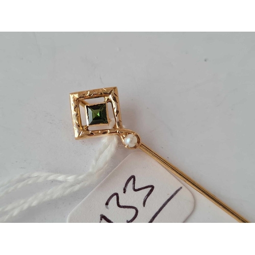 133 - A diamond shaped Tourmaline and Pearl Art Nouveau stick pin with engraved decoration set in gold