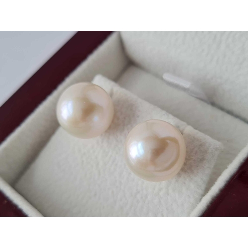 151 - A boxed pair 18ct gold pearl earrings