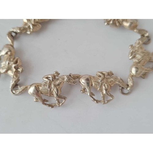 158 - Of equestrian interest a silver link bracelet each link being of a galloping races horse