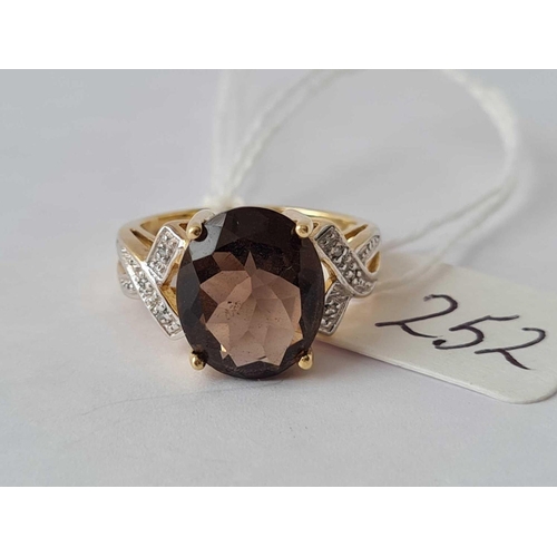 252 - A smoky quartz 9ct dress ring with diamond shoulders size K 3.5g inc