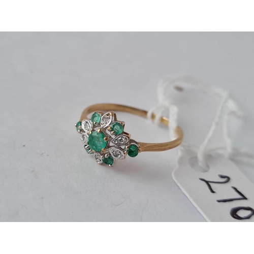 270c - A emerald and diamond vintage cluster ring 9ct size N