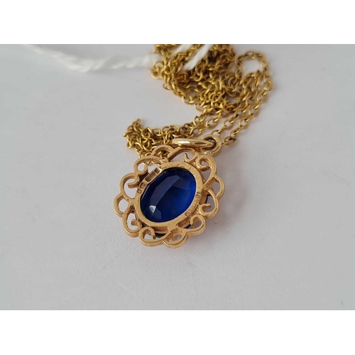 297 - 9ct blue stone pendant on 9ct chain 2.5g inc