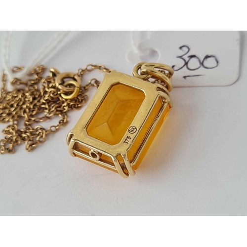 300 - A yellow stone 9ct mounted pendant on 9ct chain 6.5g inc