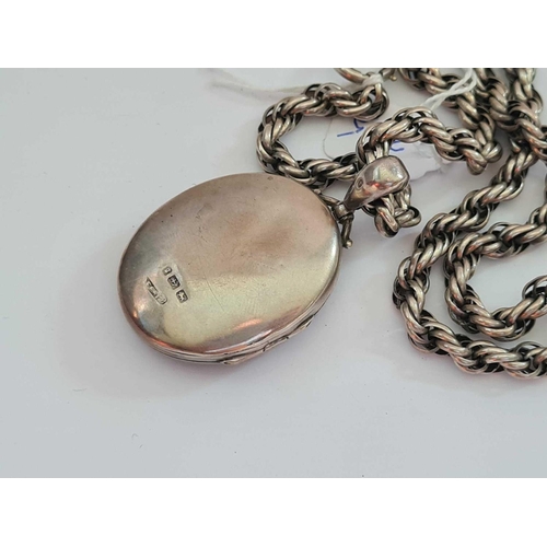 305 - A silver locket and chain