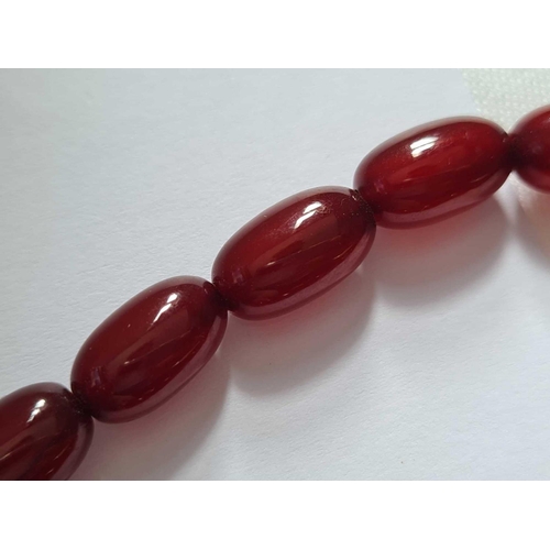 306 - A small sting of cherry amber beads � 36.5 gms