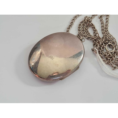 308 - A silver locket and chain