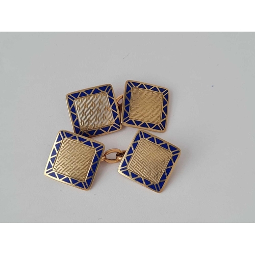 31 - A pair of gold and enamelled decorative cufflinks 9ct � 5.6 gms