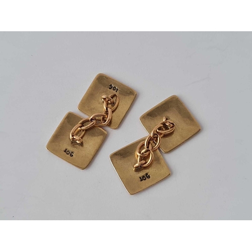 31 - A pair of gold and enamelled decorative cufflinks 9ct � 5.6 gms