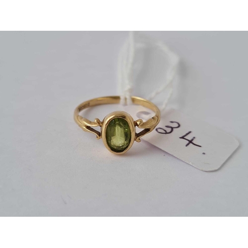 34 - A peridot ring 9ct size J