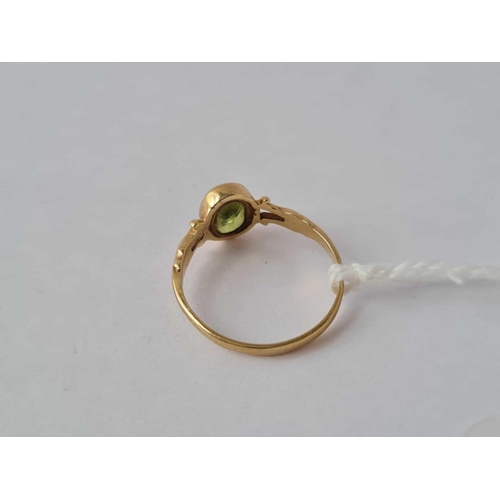 34 - A peridot ring 9ct size J