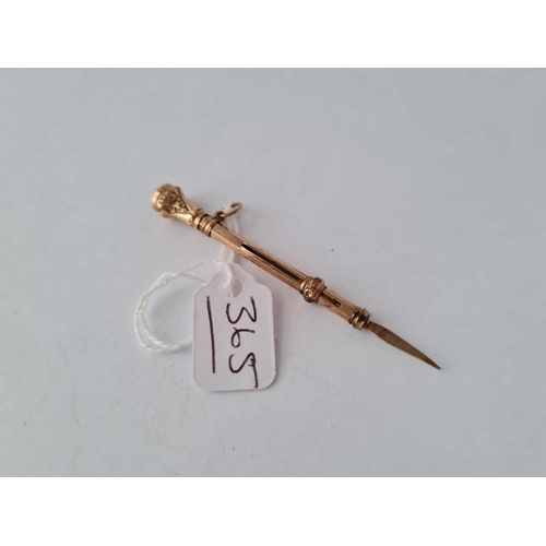 365 - A Victorian gold retractable tooth pick with amethyst terminal � 2.6 gms