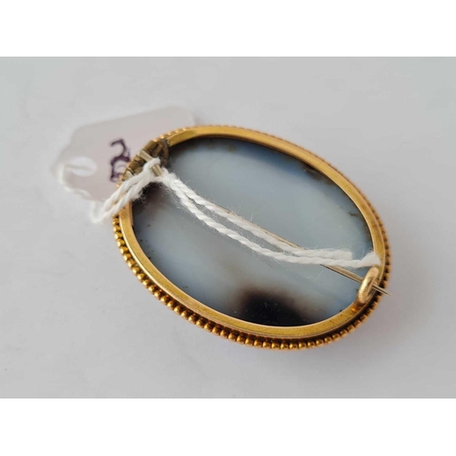 385 - A good oval banded agate brooch mounted in gold