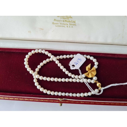 413 - A string of pearls with a 18ct gold clown drop and clasp