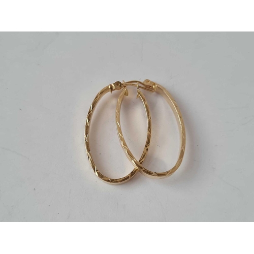 67 - A pair of 14ct gold large hoop earrings 1.2g