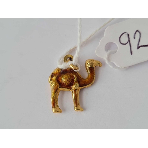 92 - A gold and enamelled charm in the form of a camel 18ct gold � 1.7 gms