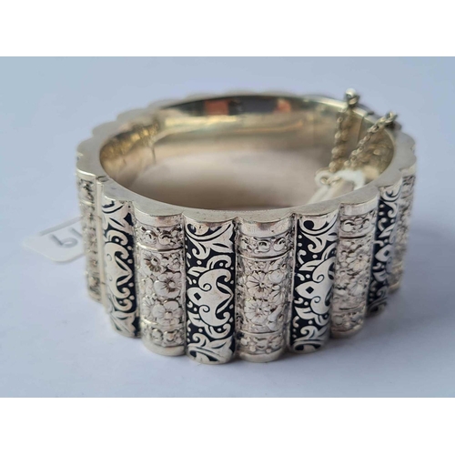 119 - A fancy silver and enamel bracelet