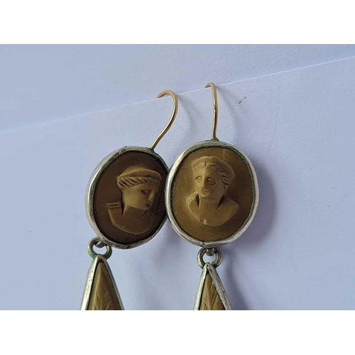 137 - A pair of carved lava cameo earrings