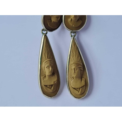 137 - A pair of carved lava cameo earrings