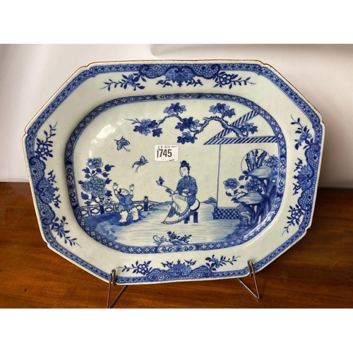 1745 - A Nankin dish painted with figures on a terrace, 14.5” wide