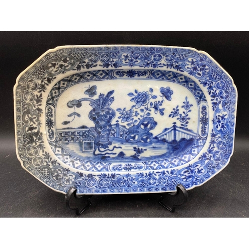 1746 - A smaller Nankin dish with vases on a terrace, 10” wide