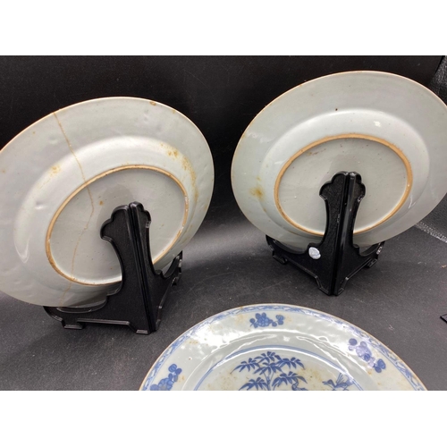 1748 - A pair of Chinese famille rose plates with flower sprays, 9” diameter and a Nankin plate