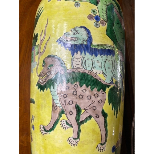 1750 - A good large Chinese vase decorated with stylised lions on a yellow ground, 22.5” high