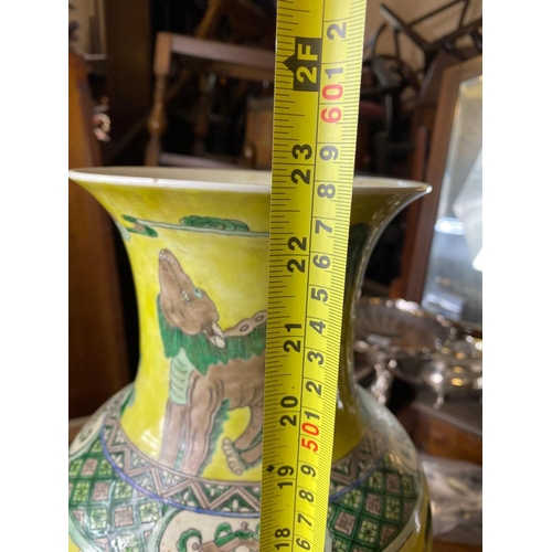 1750 - A good large Chinese vase decorated with stylised lions on a yellow ground, 22.5” high