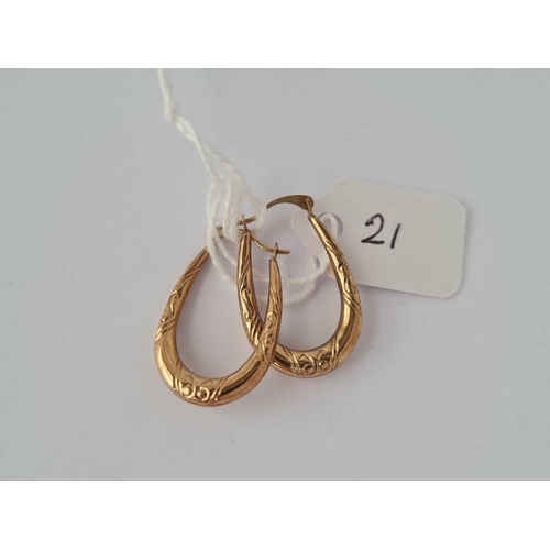 21 - A pair of hoop earrings 9ct