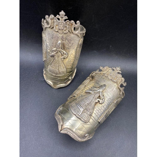 210 - A PAIR OF STUNNING PERUVIAN ORNATE CUFF BRACELETS DEPICTING A COSTUME FIGURE IN A STREET SCENE WITH ... 