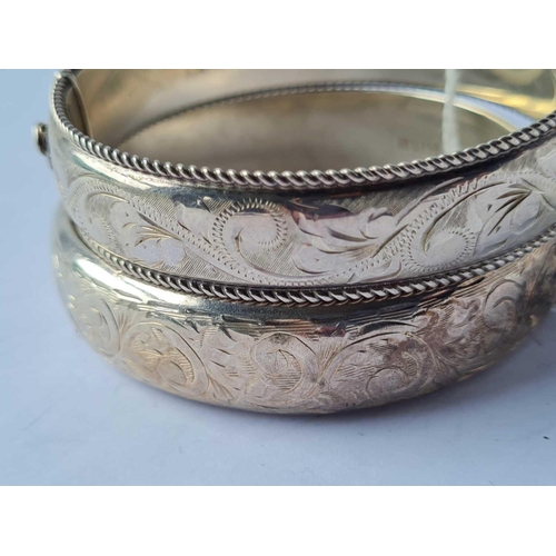 211 - Two silver bangles