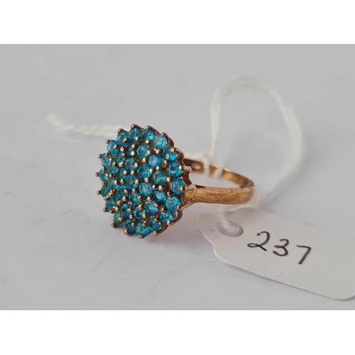 237 - A blue stone cluster ring 9ct size N