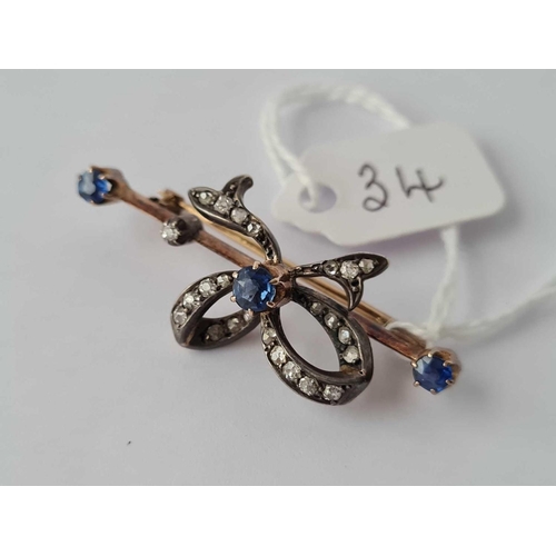 34 - A GOOD VICTORIAN GOLD SAPPHIRE AND DIAMOND RIBBON BROOCH  5.2 GMS