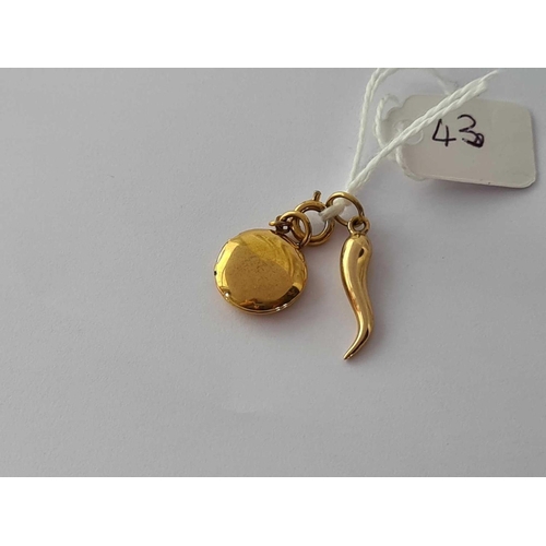 43 - A Cornucopia 14ct gold charm and a metal locket