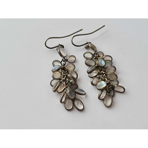 50 - A pair of silver mounted moonstone drop earrings