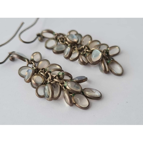 50 - A pair of silver mounted moonstone drop earrings