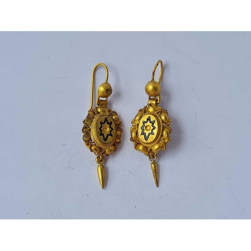 56 - A pair of Victorian yellow metal earrings