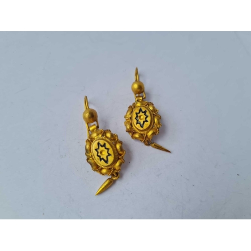 56 - A pair of Victorian yellow metal earrings