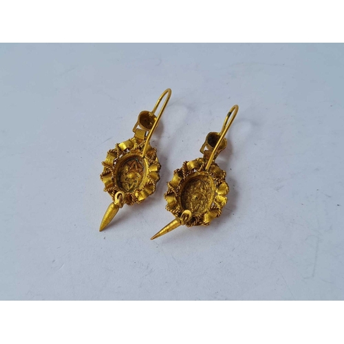 56 - A pair of Victorian yellow metal earrings