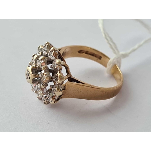 78 - A domed circular diamond cluster ring in 9ct size J 3.8g inc