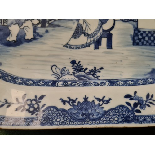 1745 - A Nankin dish painted with figures on a terrace, 14.5” wide