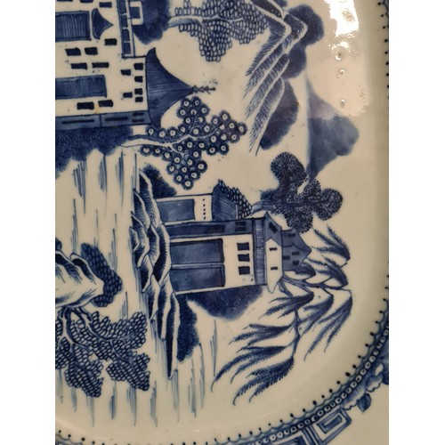 1747 - Another Nankin dish painted with buildings on a river landscape, 16” wide