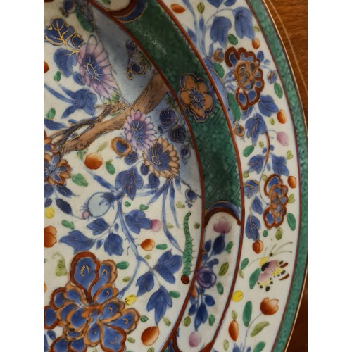 1749 - A Chinese charger enamelled with butterflies amongst flowering plant, 13” diameter