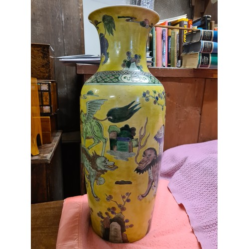 1750 - A good large Chinese vase decorated with stylised lions on a yellow ground, 22.5” high