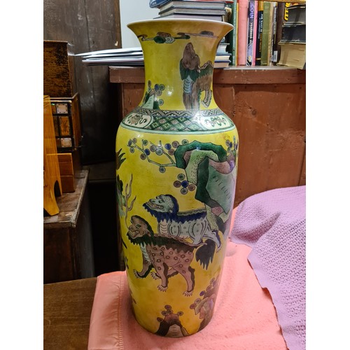 1750 - A good large Chinese vase decorated with stylised lions on a yellow ground, 22.5” high