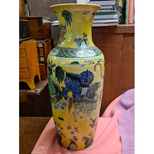 1750 - A good large Chinese vase decorated with stylised lions on a yellow ground, 22.5” high