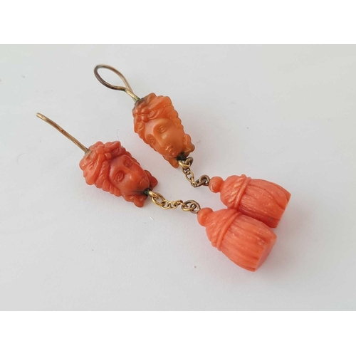 53 - A GEORGIAN PAIR OF CARVED CORAL EARRINGS WITH CLASSICAL HEAD TOPS AND TASSEL DROPS, one wire is A/F