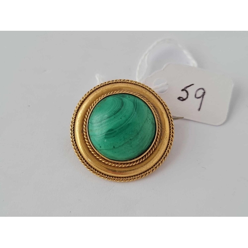 59 - A Victorian malachite brooch with locket back 15ct gold