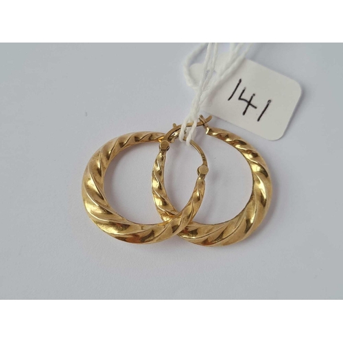 141 - A pair of twist design earrings, 9ct, 1.7 g.