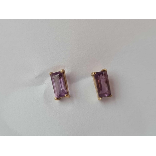 150 - A pair of amethyst ear studs, 9ct