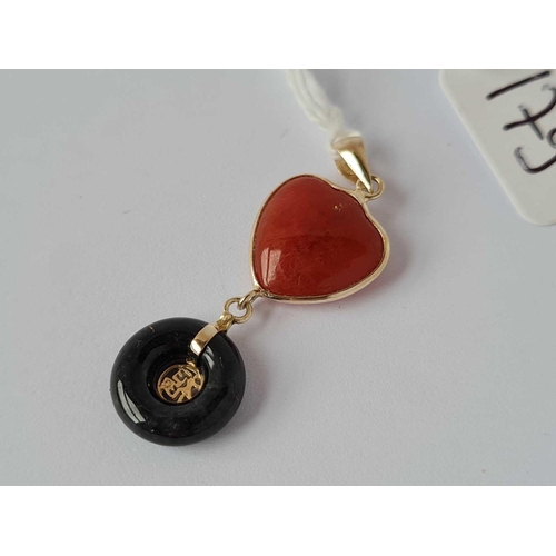 179 - A pretty carnelian and black jade heart and disc high carat good luck and love pendant